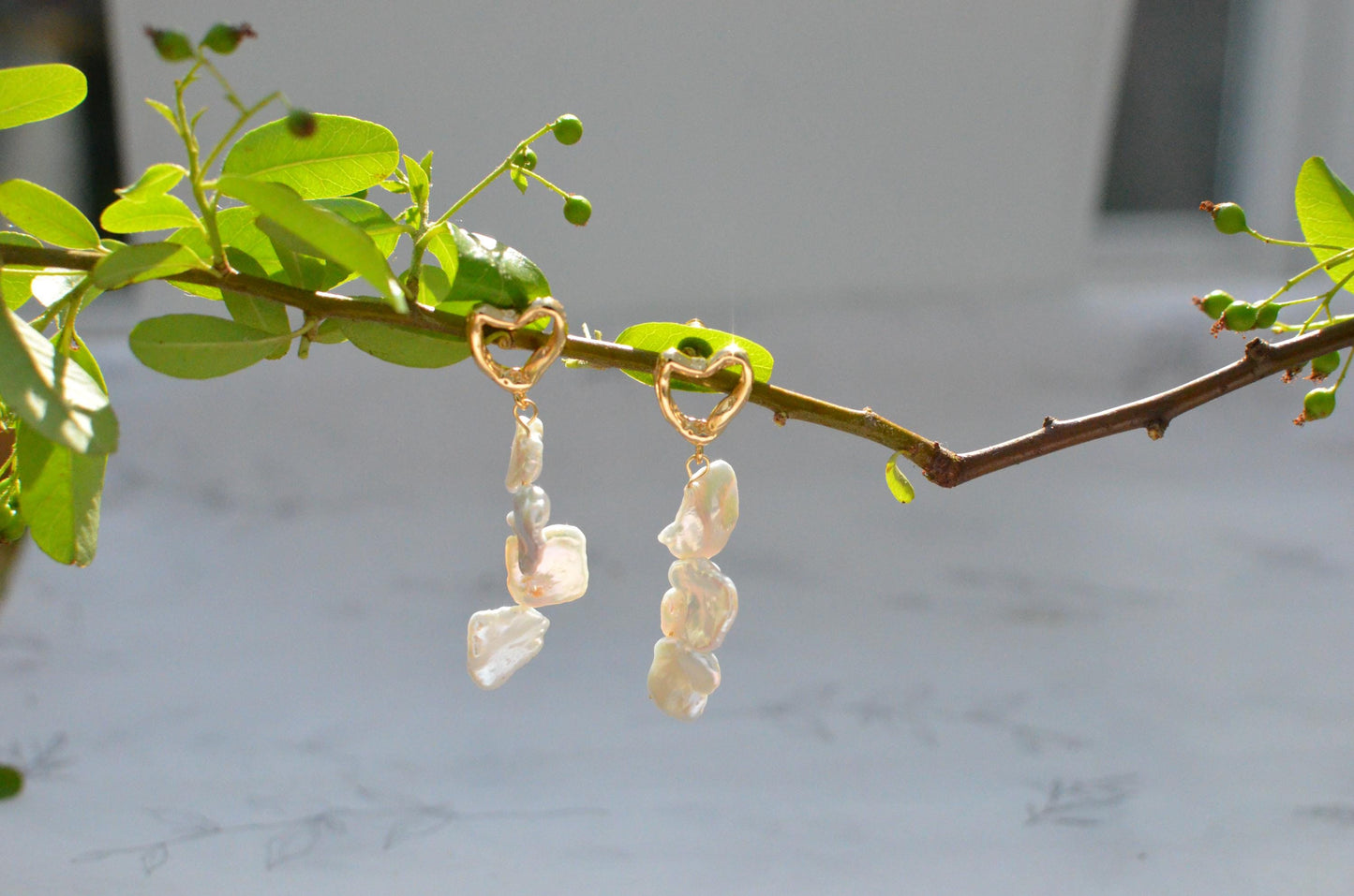 Golden Heart and Baroque Pearl Dangle Earrings .