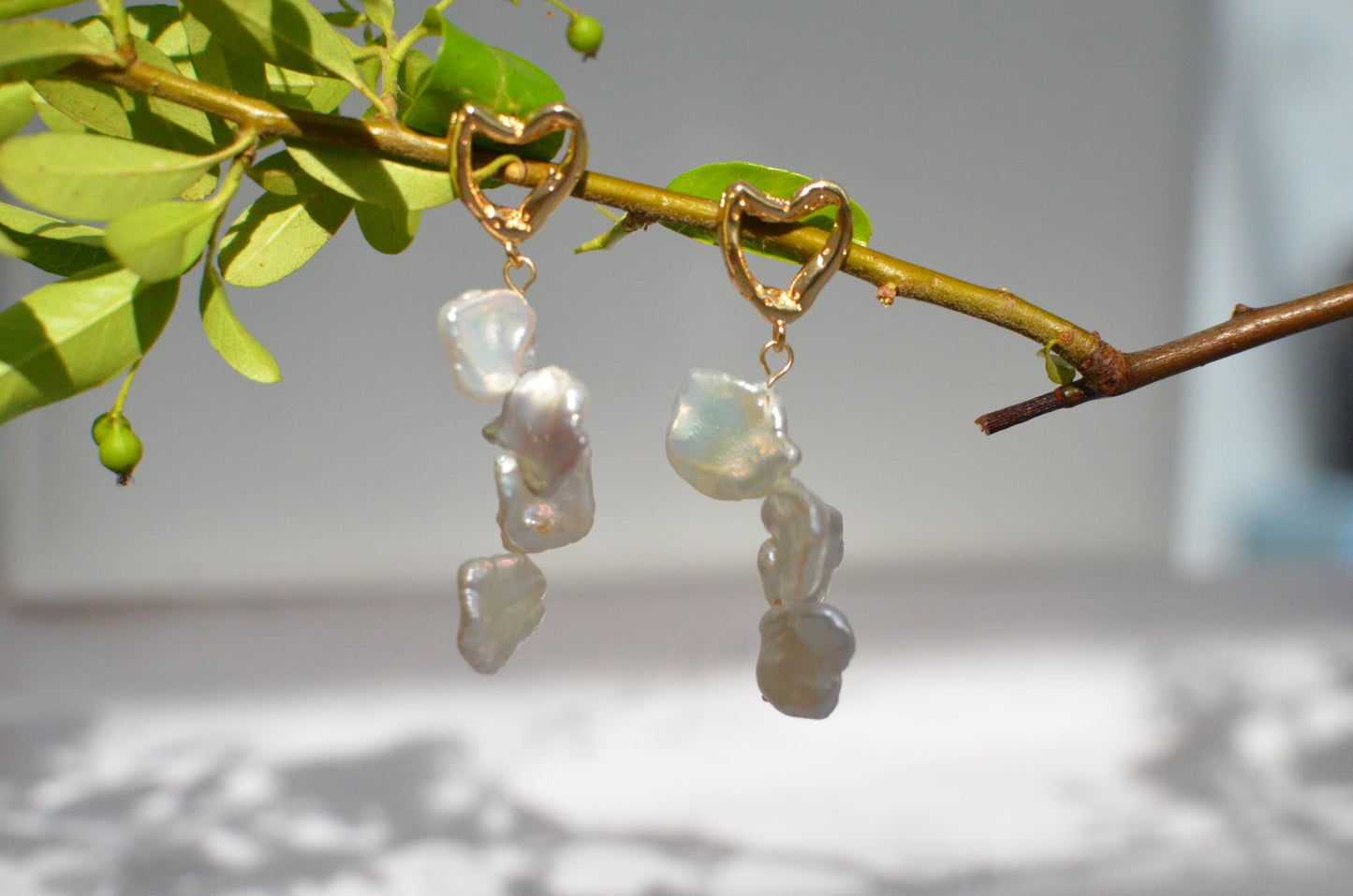 Golden Heart and Baroque Pearl Dangle Earrings .