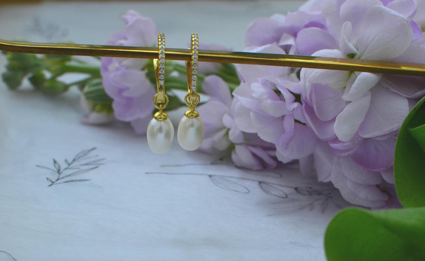 Gold Hoop Earrings with teardrop-shaped Freshwater Pearl Drop