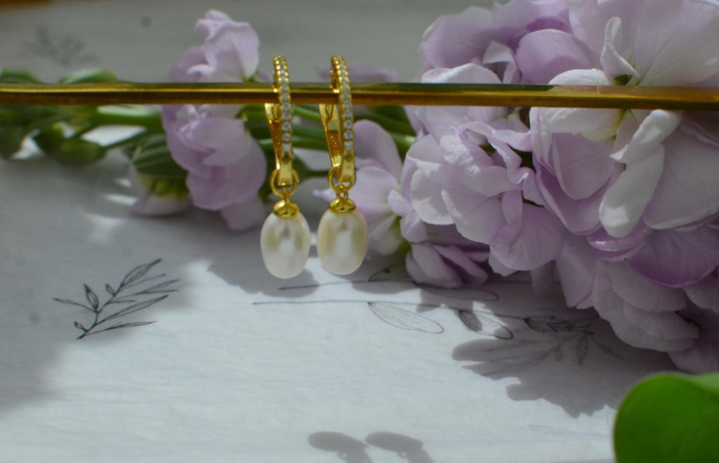 Gold Hoop Earrings with teardrop-shaped Freshwater Pearl Drop