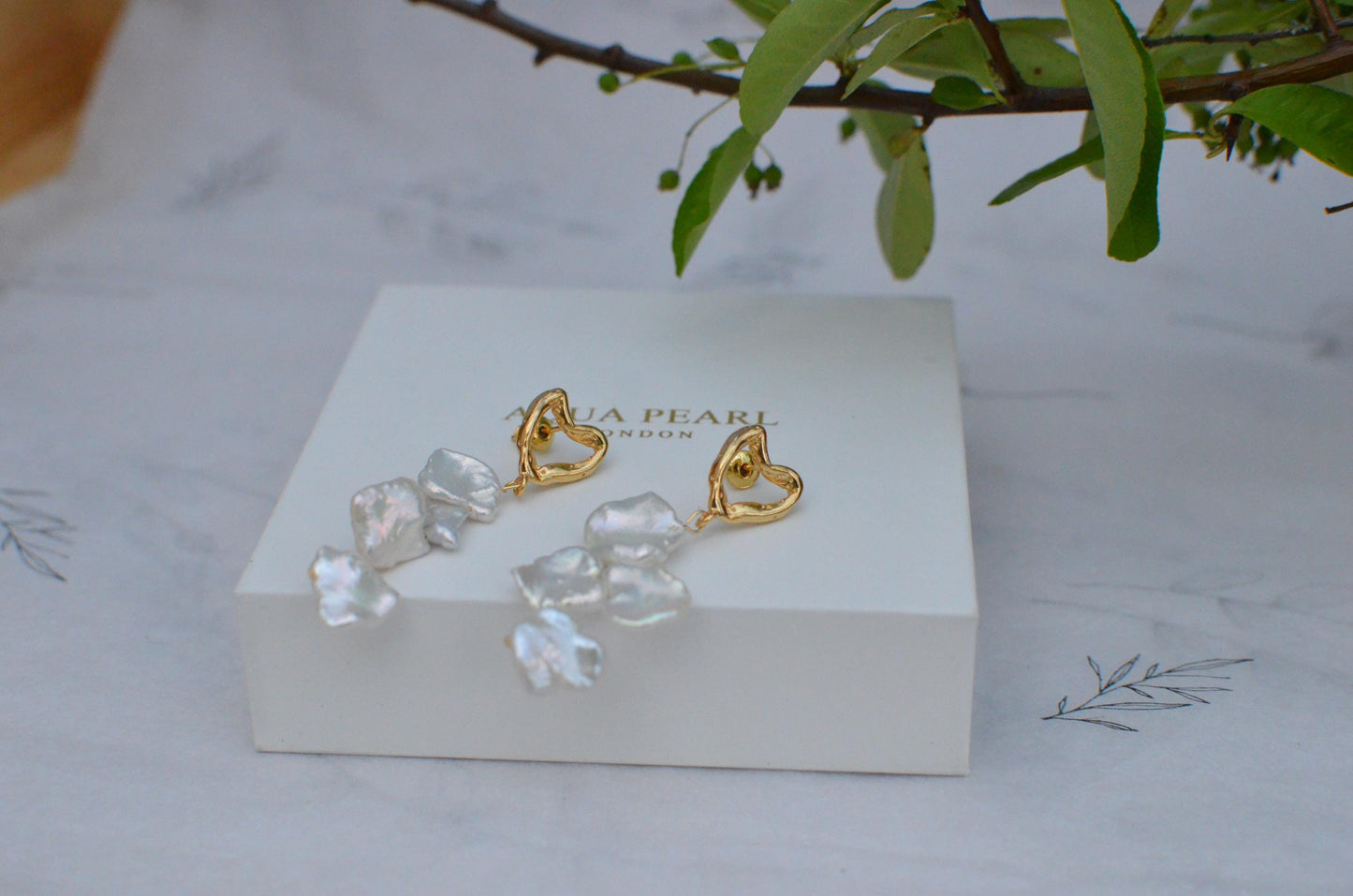 Golden Heart and Baroque Pearl Dangle Earrings .