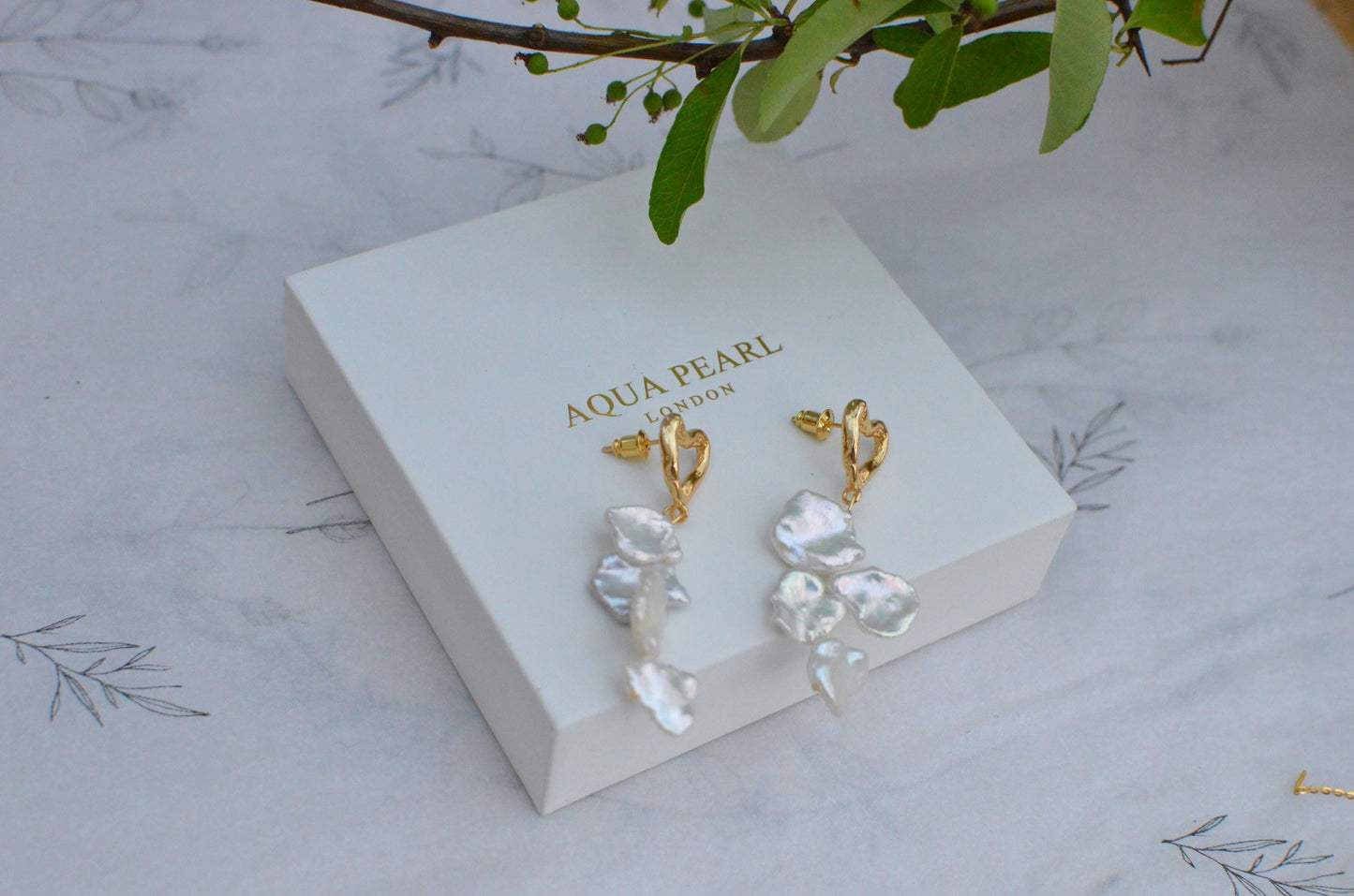 Golden Heart and Baroque Pearl Dangle Earrings .