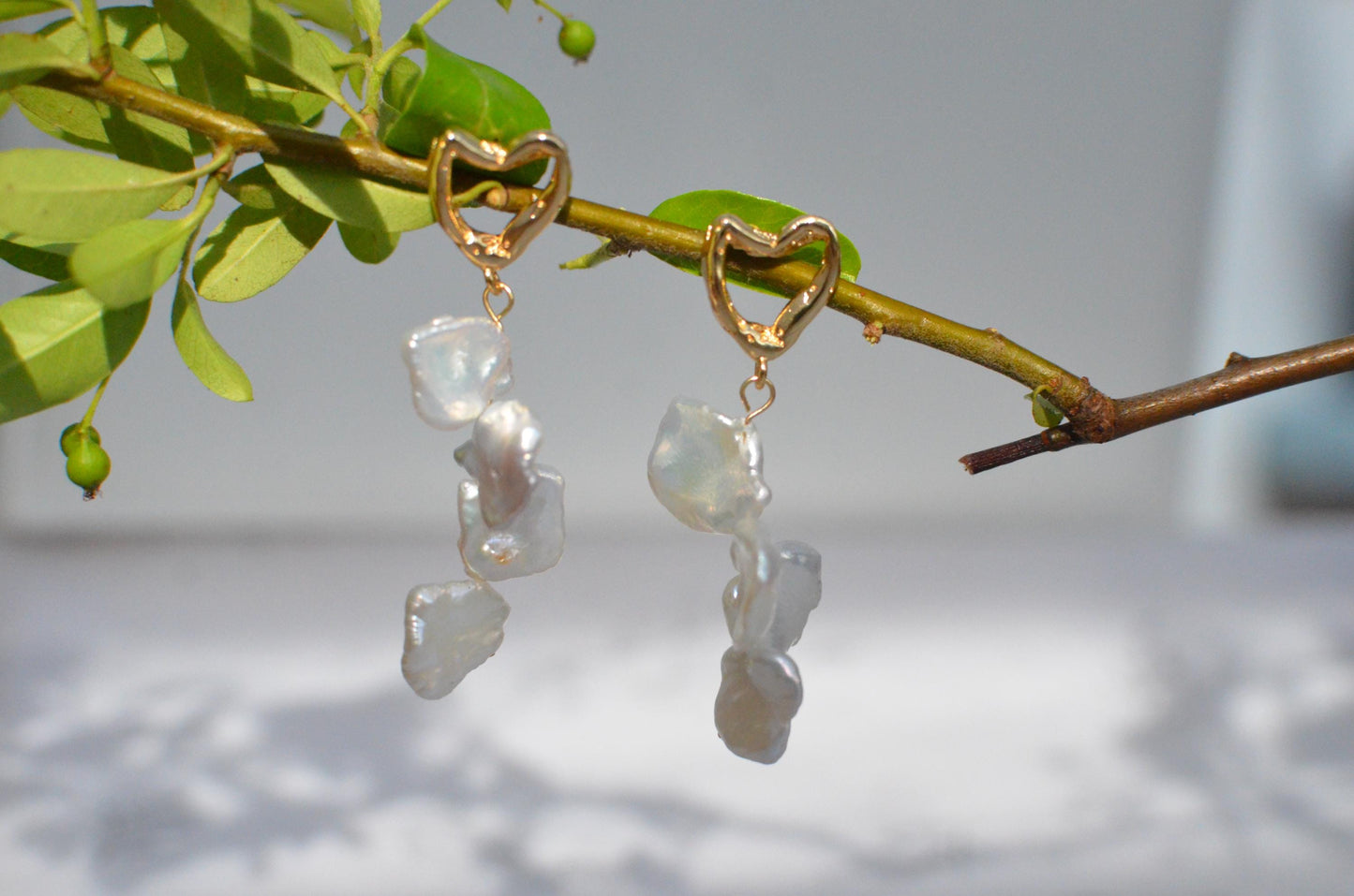 Golden Heart and Baroque Pearl Dangle Earrings .