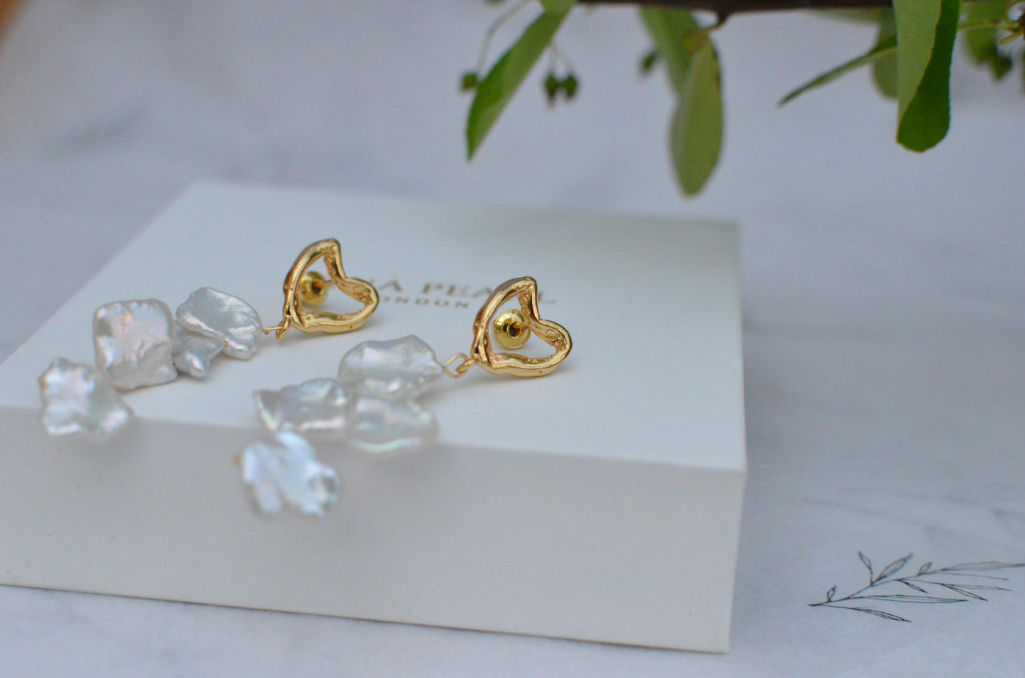 Golden Heart and Baroque Pearl Dangle Earrings .