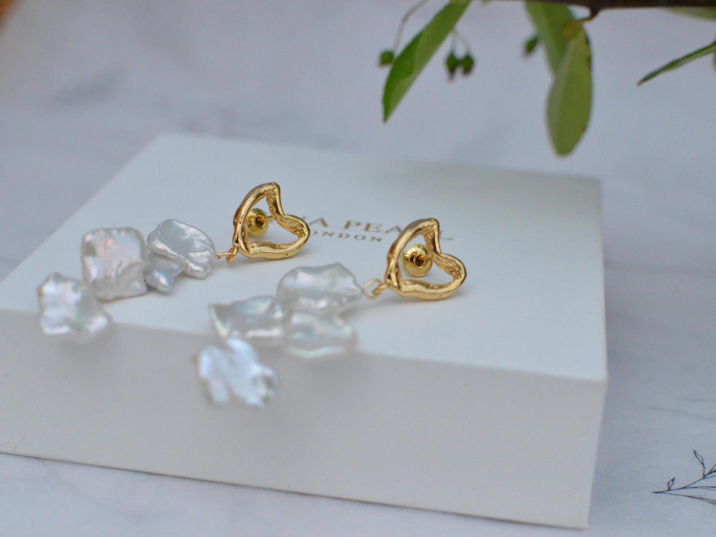 Golden Heart and Baroque Pearl Dangle Earrings .
